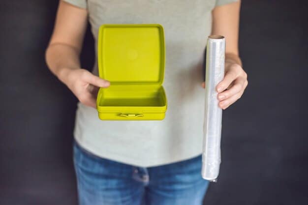A person wrapping a sandwich with a beeswax wrap, demonstrating a sustainable alternative to plastic wrap for food storage.