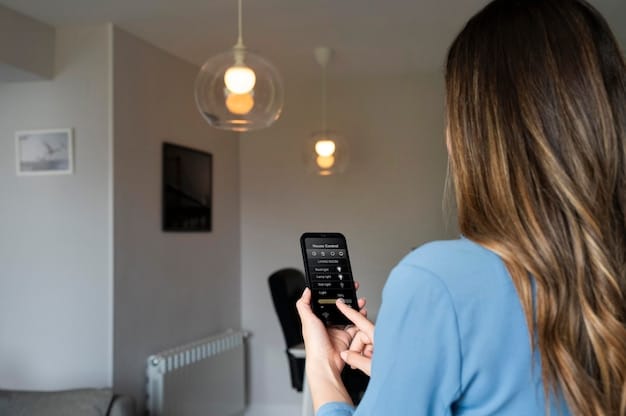 A person holding an energy bill next to a smart thermostat, showcasing the tracking of energy consumption and the use of smart home technology.