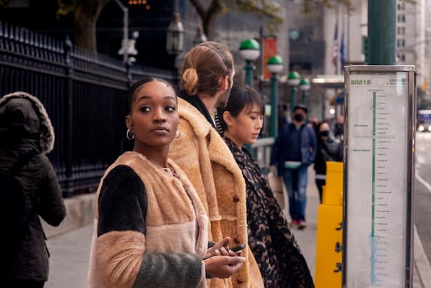 A diverse group of people waiting at a bus stop in a bustling city, emphasizing the accessibility and convenience of public transportation.
