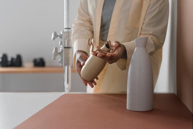 A close-up shot of a person refilling a reusable water bottle from a water dispenser in an office setting, highlighting the importance of staying hydrated while reducing plastic consumption.