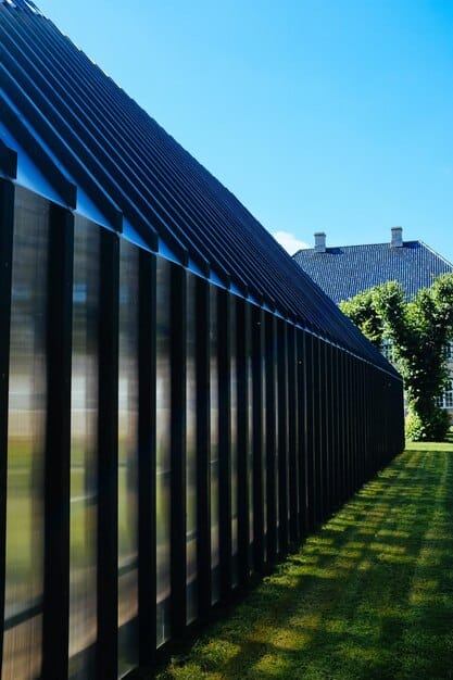 Close-up of thin-film solar panels seamlessly integrated into the roof of a modern home, reflecting the sunlight at different angles.