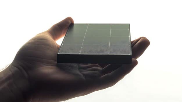 A close-up of a hand holding a small solar panel, with rows of larger solar panels stretching into the distance. The image emphasizes the potential of solar energy and the importance of government incentives in promoting its growth.