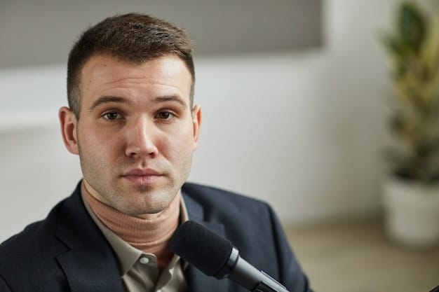 A close-up shot of a FERC Commissioner during a public hearing, focusing on their face and the documents they are reviewing. The background shows other commissioners and staff, with the FERC logo visible but slightly blurred.