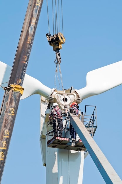 A bustling wind turbine blade factory, with workers using heavy machinery to construct large turbine blades and transport them for shipping.