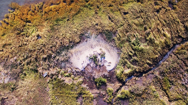 A landscape view of a geological storage site for captured CO2, showing underground injection wells and monitoring equipment. The image highlights the safety and security measures in place to ensure the permanent storage of CO2.