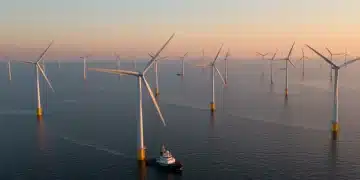 Offshore wind farm at sunrise, symbolizing clean energy investment