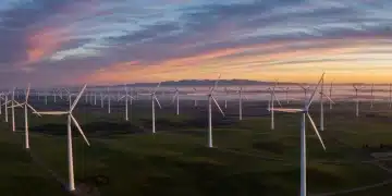 Wind farm at sunrise, symbolizing US wind energy growth.