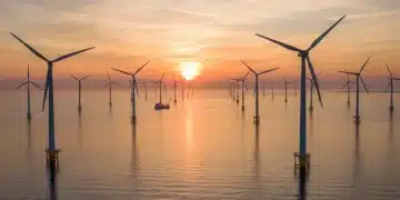 Sunrise over a large offshore wind farm, symbolizing US offshore wind growth