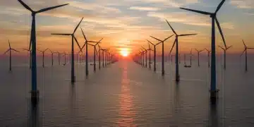 Offshore wind farm at sunrise, symbolizing renewable energy growth in the US.